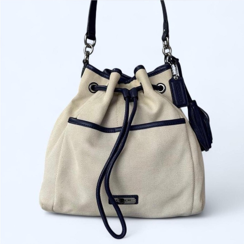 COACH Avery Canvas and Leather Bucket Bag with attachable shoulder strap.
